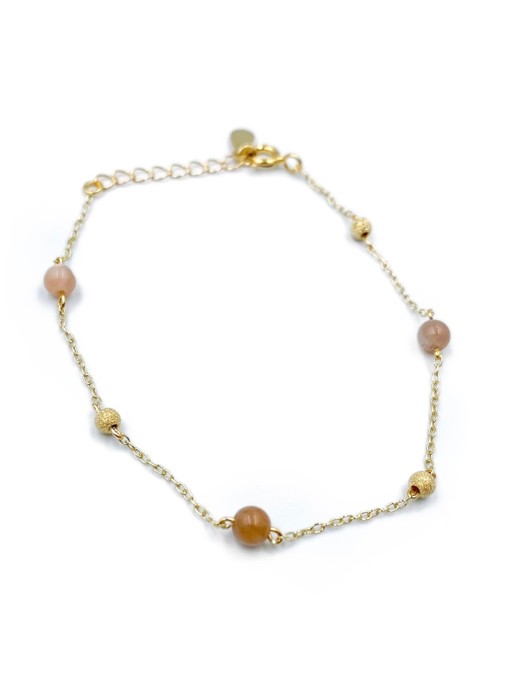 Guld armbånd med brune perler